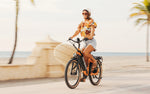 Heybike-Cityrun-Step-Thru-Commuter-Ebike-Orange-Girl-Cycling