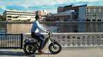 man-commuting-on-magicycle-ocelot-pro-electric-step-thru-fat-tire-e-bike