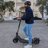 xnito-e-bike-helmet-man-riding-kick-escooter